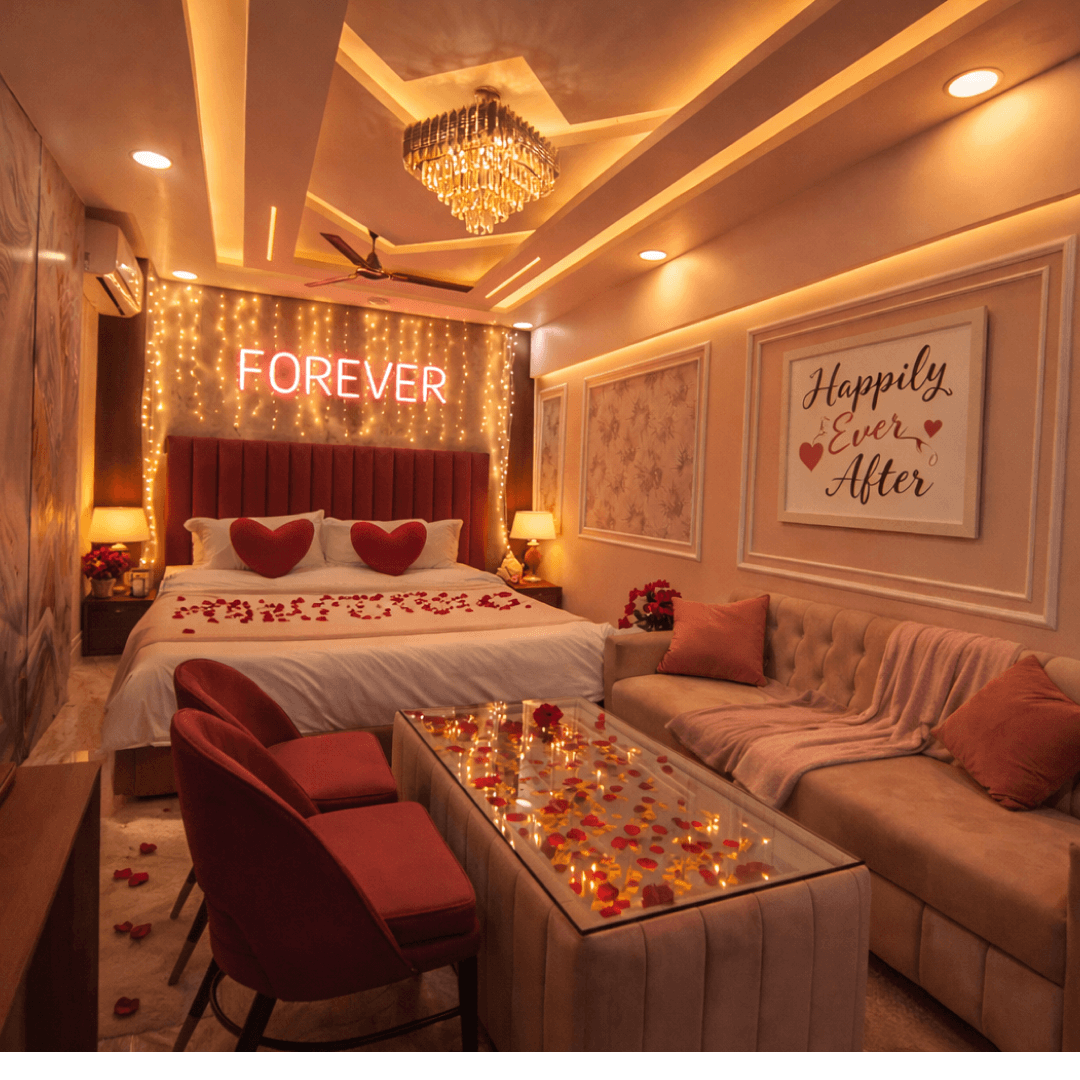 Couple relaxing in a clean and comfortable deluxe hotel room at Navodaya Sarovar, Orai, featuring modern interiors, cozy bedding, and a peaceful stay experience.