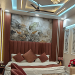 Luxury hotel room with king size bed and modern lighting in Orai