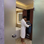 Hotel room wardrobe and attached modern bathroom in Orai