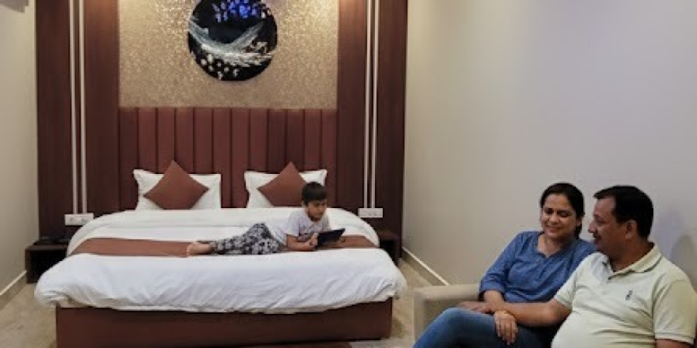 spacious hotel room Super Deluxe Room with modern interior and king size bed